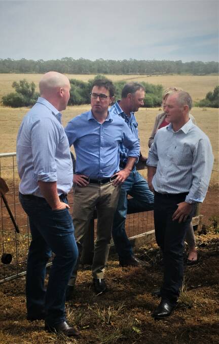 Out and about: New federal agriculture minster David Littleproud, second from left,  talks with south-west dairy farmer Lachie Sutherland, left, and UDV president Adam Jenkins at Purrumbete.