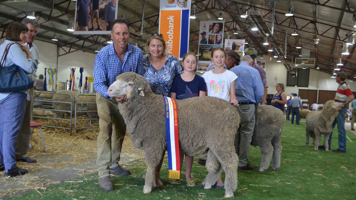 Doug, Lucy, Georgie and Mollie Walker, Wongara, Junee with their champion August-shorn Poll Merino ram and junior champion Poll Merino ram
