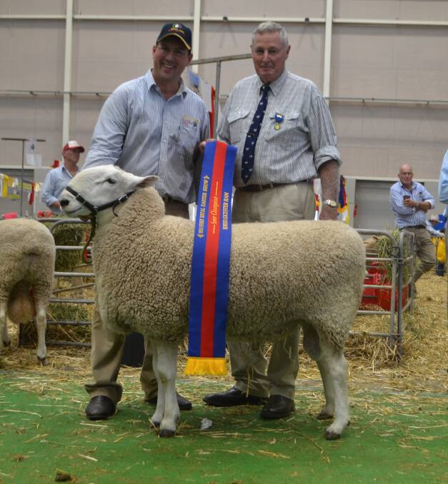 Jeff Sutton, Wattle Farm stud, Temora, with the grand champion Border Leicester ram, judged by Ian Cameron, Narromine.