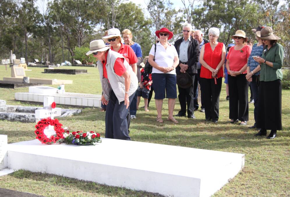 Wreath laying at the gravesite of Reverend White on Anzac Day.