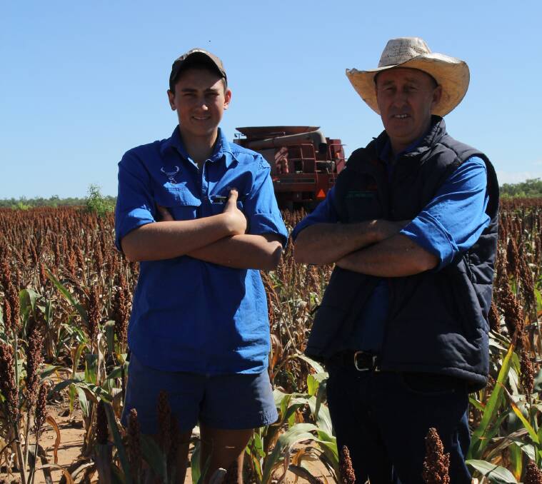 Securing Farming Future: Scott Harris and his son Tom, 16, are in the middle of harvesting their grain sorghum crop on Strathmore Station, Georgetown.