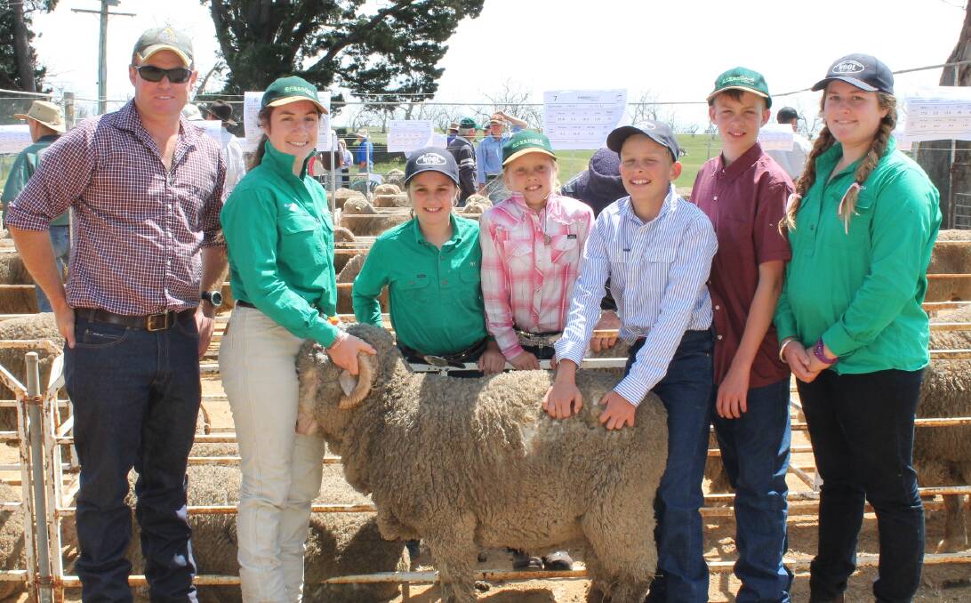 TOP SELECTION: Jack Glasson Jimenbuen Pastoral Co, is pictured with Florance, Ivy, Elle, Lachlan, James and Miranda McGufficke.