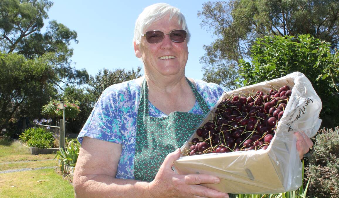 PICK OF THE CROP: Ann Adams pictured with one of the last boxes of cherries from the Oura orchard where fruit has sold out this year. Picture: Nikki Reynolds