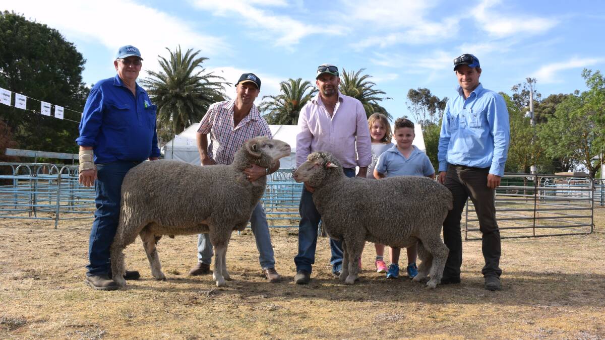 Western Australian buyer Darren Trotter, Perrilup Estate, Perrilup, purchased the two top-priced rams, which are pictured with Glendemar's Ken Duxson, Mr Trotter, Ben Duxson his children Ava, 10, and Jimmy, 8, and Hamish Thompson, Moojepin Multi Purpose Merinos, Katanning, WA.