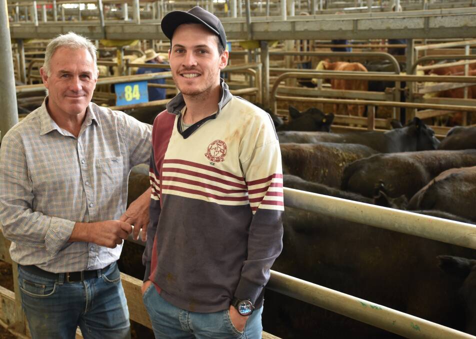 Malcolm (left) and Sam Davies, Greenwald Pastoral Co, Dartmoor, where very happy with the sale of their 124 Angus steers, dunoon blood, at Leongatha, Thursday. Selling to $1656, they averaged $1424. Photo by Joely Mitchell.
