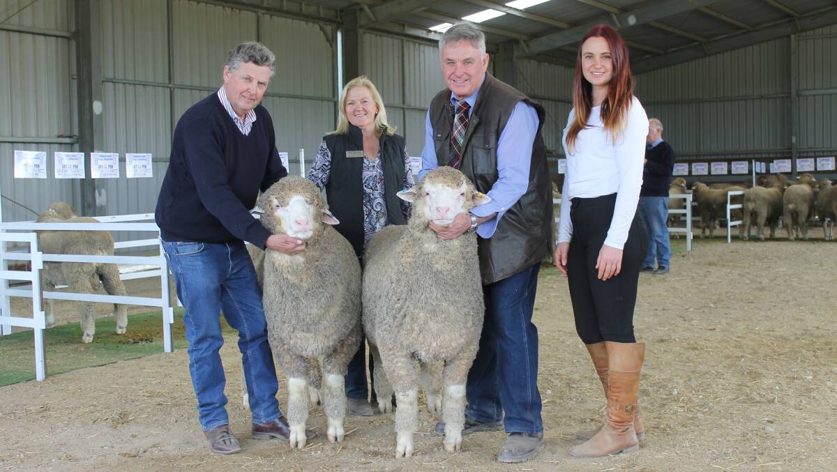 Sheep classer Chris Bowman, Hay, NSW, and Terrick West's Robyn, Ross and Claire McGauchie, with the two rams bought for the Duncan family, Craigneuk, New Zealand. The ram to the left was purchased for $10,000 at Sheepvention on Tuesday and the one to the right was purchased for $4000 to top the stud's on-property sale on Friday.