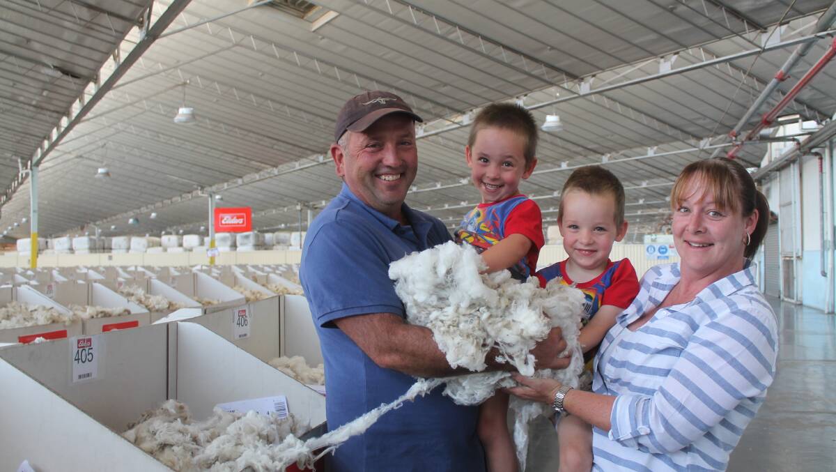 The Foster family, Russell, twins Jayden and Rhys, 4, and Colleen at the Melbourne wool stores.