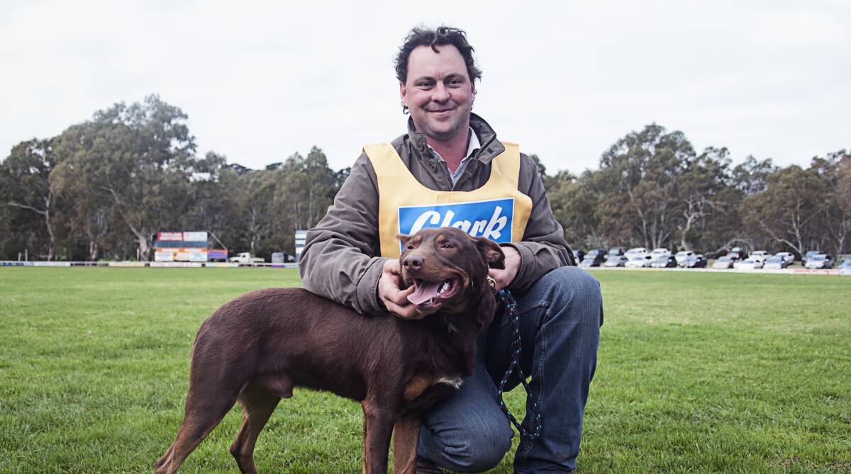 The running total for the Casterton-based working dog auction passed the $2 million mark with the sale of lot 48, pictured with John Ahern.