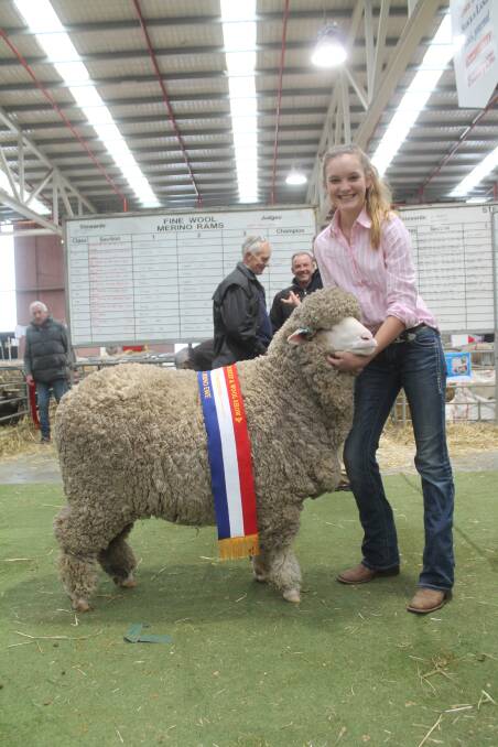 Cilla Clonan​, Alfoxton, Armidale, NSW, with the grand champion Poll Merino ewe. Photo: Laura Griffin