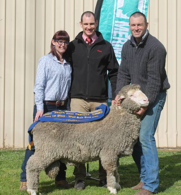 Anna Toland and Simon Riddle, Toland Merino and Poll Merino, Violet Town, sold the top-priced ram last year and are pictured flanking Rex Bennett, Elders.