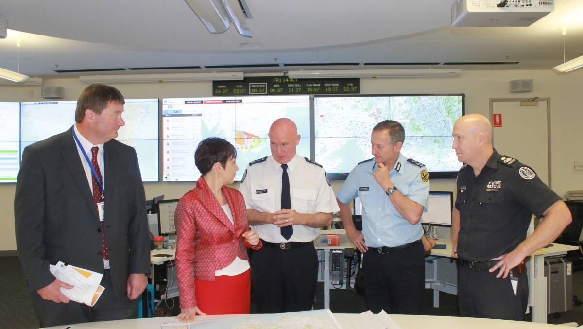 Chief Veterinary Officer Dr Charles Milne (left), Agriculture Minister Jaala Pulford, Emergency Management Commissioner Craig Lapsley, Victoria State Emergency Service Deputy Chief Officer David Baker and CFA Operations Manager Jason Lawrence at the State Control Centre in Melbourne.
