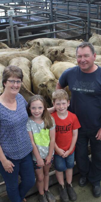 Kerrie, Emily, 9, Charlie, 7, and Byron Kershaw. Their top 19 Charolais-Angus heifers, Mt William bld, 367kg, sold for $1310. Mr Kershaw said that was $200-$300 up on last year.