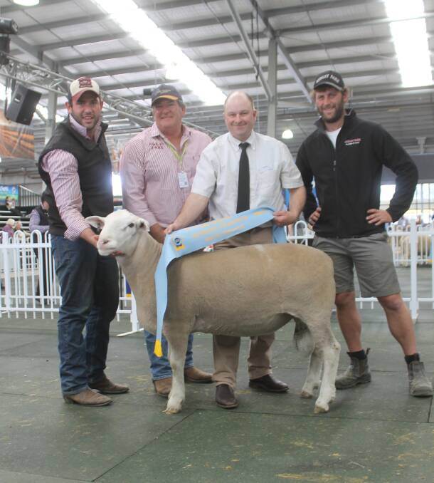 Ashley Park, Bairnsdale, won the supreme White Suffolk exhibit, with it are Reagn Kyle, Ian Kyle, judge Paul Day and Rob Kyle.