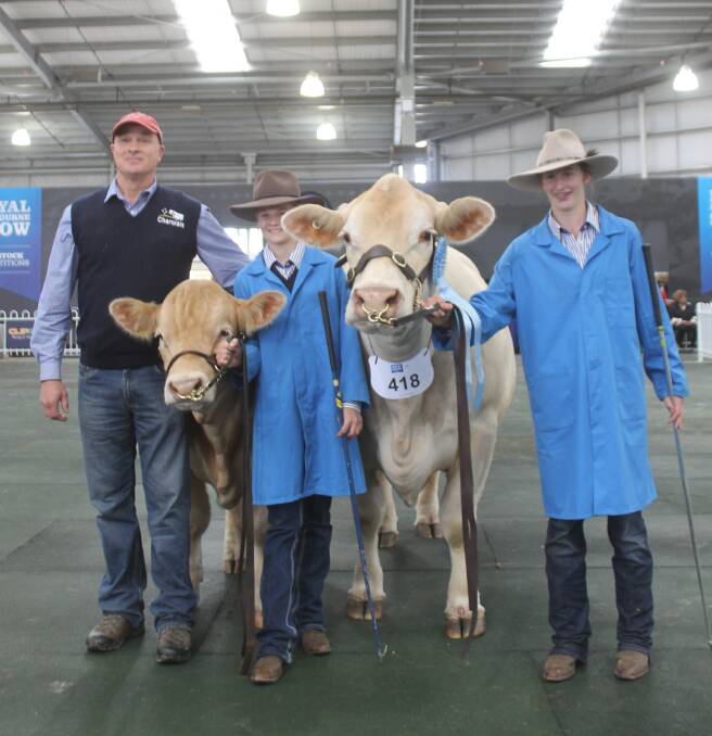 Graeme Cook, Rangan Charolais stud, Chareloi, with daughters Laura, 14, and Jess, 16, with their supreme-winning cow.