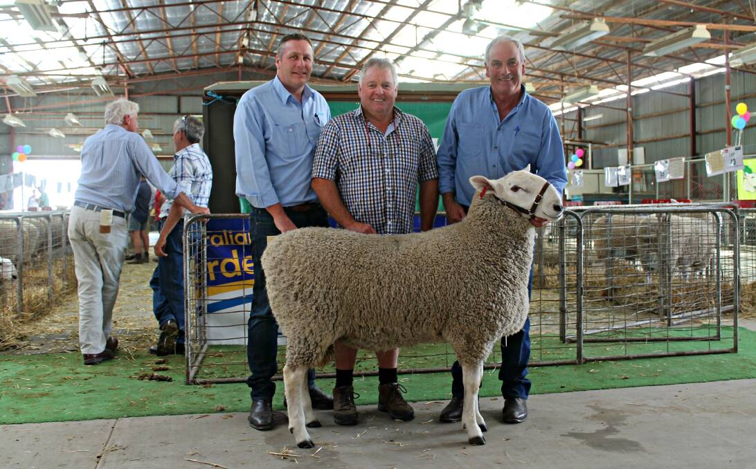 Sale-topper: Michael Capes, Wyndham Livestock, Bairnsdale with the buyer of the top price ram, Garry Davidson, Lucas Creek, Bairnsdale who purchased lot 30 for $9750 from Ian Baker, Geraldine, Clydebank.
﻿