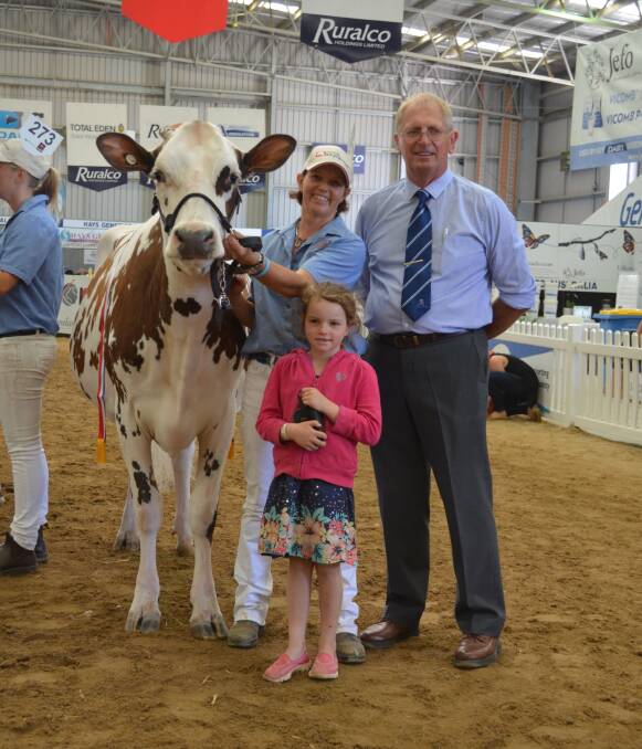 Owner of the junior champion Ayrshire Rebecca Cole with her daughter Indianna, 6, and judge Max Hyland.