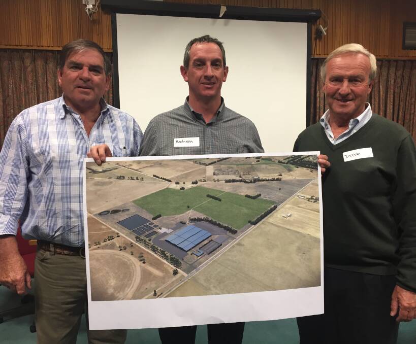 SEEKING APPROVAL: Western Victoria Livestock Exchange developers Brendan Abbey, Rohan Arnold and David Hewlett with a rendered image of the saleyard proposal at Mortlake.