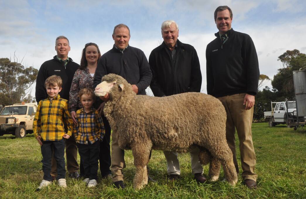 ON-PROPERTY RECORD: Landmark auctioneer Gordon Wood, Marianne and Peter Wallis and sons James and Nathaniel with their $33,000 ram which set a new on-property record for Glenlea Park stud. Also pictured is buyer Len Mathews, Bulgandri Poll stud, Rand, NSW and Landmark auctioneer Richard Miller. 