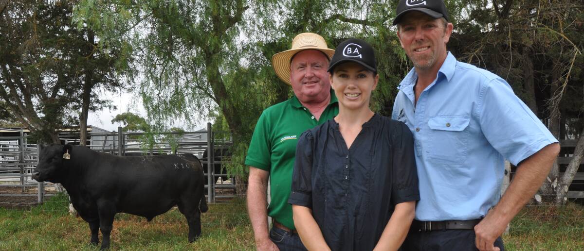 TOP MENTOR: Landmark Colac's Roy Harlock paid the $11,500 top price for Lot 35, Black Angus Mentor K107. He is with Glatz Black Angus stud's Samantha and Ben Glatz.