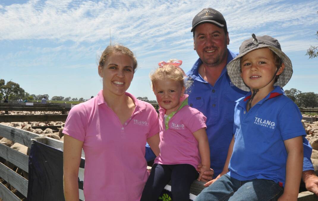 Kirsty and Rob Starling and their daughter Annie and son Jack at the family's 25th annual East Friesian-Border Leicester-Merino lamb sale where ewes topped at $226 and wethers made to $114.