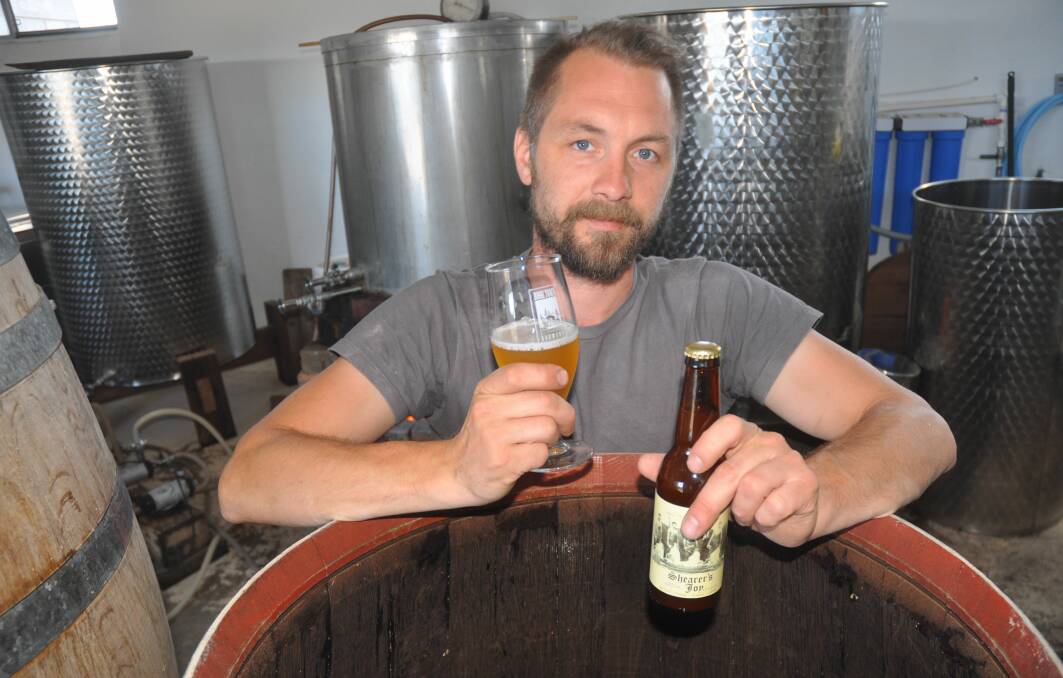 CRAFTY BEERS: Robe Town Brewery owner Maris Biezaitis with one of his popular beers - the Shearer's Joy Farmhouse Ale, made with ingredients and techniques inspired from the colonial era.