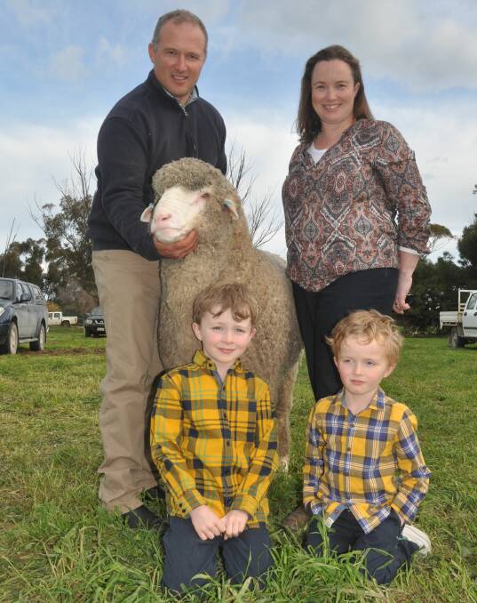 MALLEE MIGHT: Peter and Marianne Wallis, Glenlea Park, Pinnaroo, and sons James and Nathaniel with their $33,000 top price ram - the highest priced ram sold in 2016.