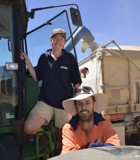 FINAL RUNS: Chaser bin driver Melinda Oster and brother-in-law Giles Oster, Pinnaroo, were rushing to finish off the family's 2600-hectare harvest before this week's rain.