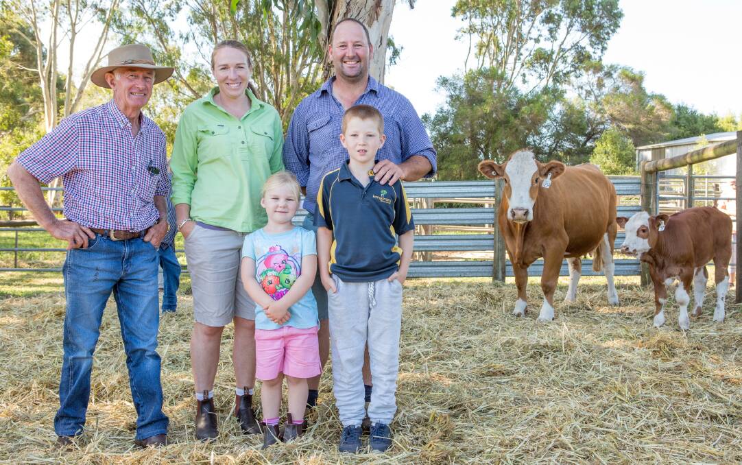 Tugulawa stud's Gary Allen, with the Lucas family, Sarah, Matt, Claire and Ryan, Glenmoor Simmentals, Kongorong, with lot 25 Tugulawa Katherine with bull calf at-foot, purchased for $7000.