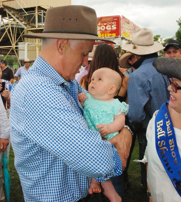 Similarities: Prime Minister Malcolm Turnbull holding 5-month-old Grace Raven during his visit to Bell Show on Queensland's Western Downs. Picture: Martin Bunyard.