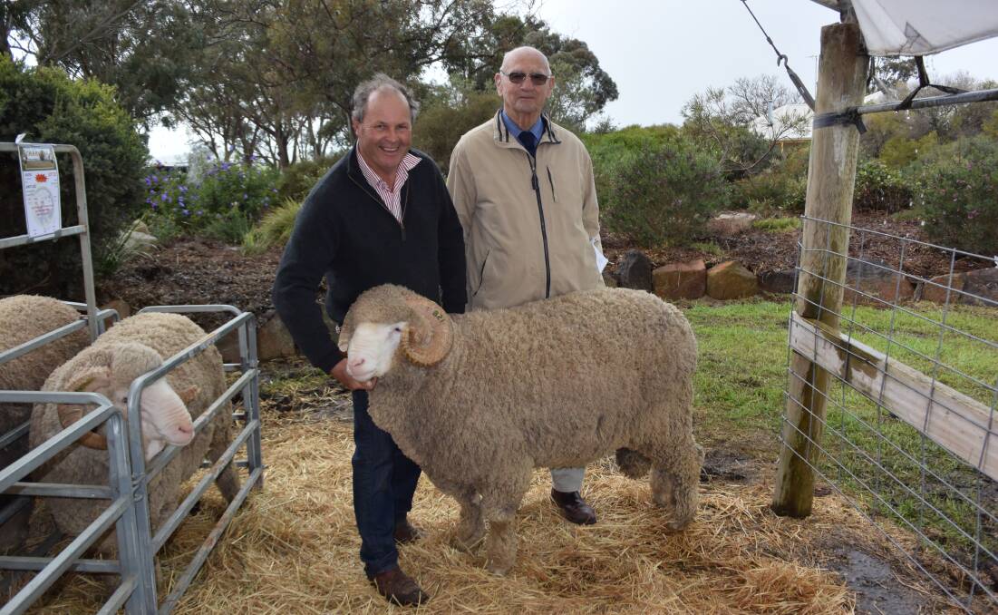 Charinga stud principal Roger Polkinghorne with wool industry expert Tom Padbury. Mr Padbury bought this $11,000 ram for local farmer Chris Guthrie, Rich Avon.