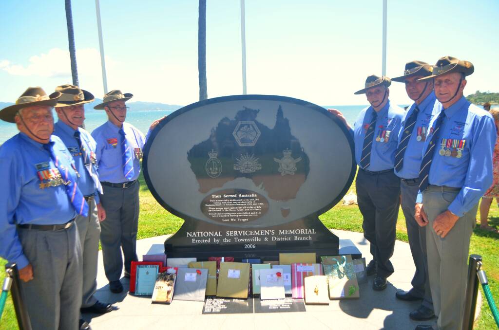 Remembering the fallen: NASHOS Townsville and District Branch members (clockwise from front left) Neville Coleman; Phil Nicholson; Maurie Degiovanni; branch president Warren Hegarty; Neville Hines and Leon Jeffery at the memorial plaque which was erected in Rowes Bay in 2006.