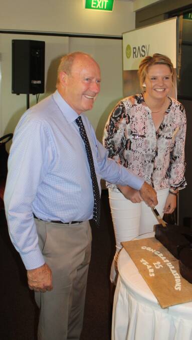 Beef Week committee chairman Daryl Pearson and Stock and Land stud stock representative Dianna Branson cut the annivesary cake.. 