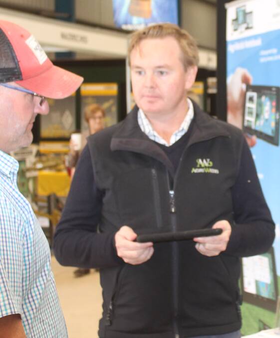 Lachland McLeod was taken through AgriWebb's products by Will Daley, at the company's stand, in the Baw Baw Pavillion.