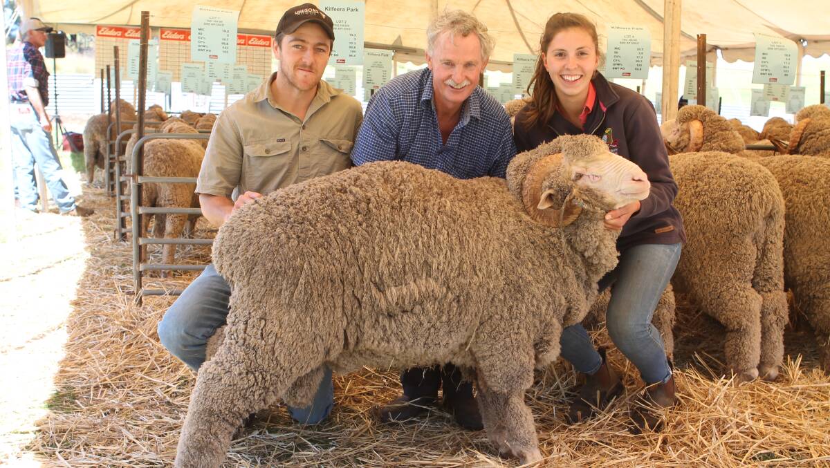 SALE TOPPER: Tim Somerville, Frederick Hill, Baddaginnie - a regular buyer at Kilfeera Park, stud principal Murray McKenzie and Tamara Pabst, Dookie Agricultural college student, with the top priced ram.
