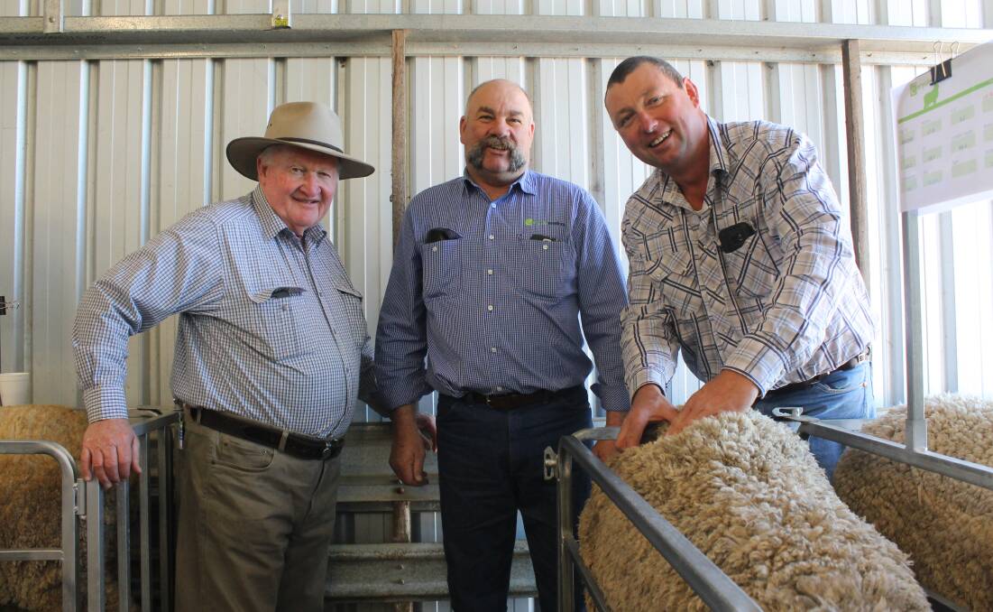 Wodonga sheep classer, Bill Mildren, with Coryule principal, Craig Trickey and Jack Briscoe, Geelong.
