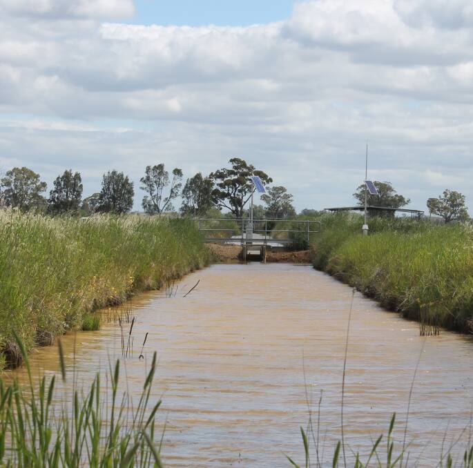 IRRIGATION WOES: An irrigation channel, near Tatura. The RM Consulting Group (RMCG) found irrigators were paying $20 million a year more, for temporary water.