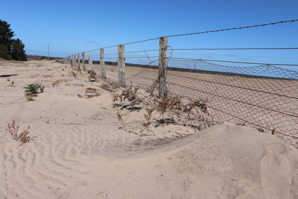 GIPPSLAND DROUGHT: Strong winds caused further pain for Central Gippsland farmers, stripping topsoil and sand and piling it against fences.