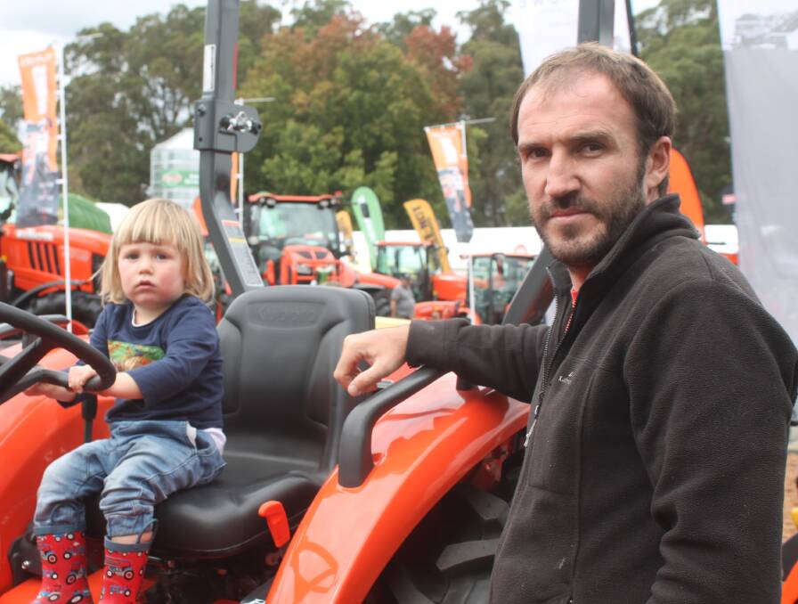 Raph Henwood, 2, from the Mornington Peninsula, took to one of the tractors on display, under dad, Adam's, watchful eye.