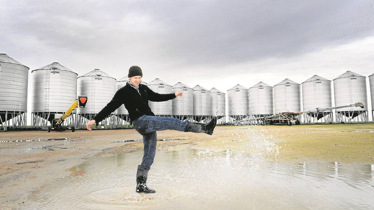 RAINING AGAIN: Horsham farmer Tim Rethus was happy after widespread rain in the Wimmera last June - and was singing again, after the latest falls. Picture: PAUL CARRACHER