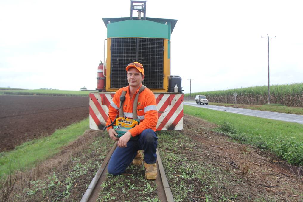 Up close: Locomotive driver Craig Stoter dispels the myth that cane train locomotives are small and not dangerous to children. Photo supplied.