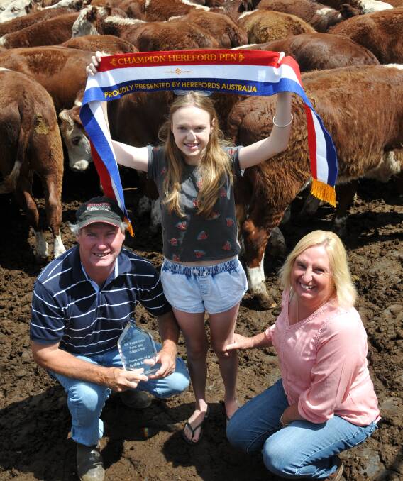 Winners grinners: Paul, Hayley and Caroline Malseed, Orana, Condah with the best Hereford pen at the Hamilton weaner sale on Wednesday. They sold 89 steers to 353c/kg paid by Paul Mason, Wellington, NSW. 