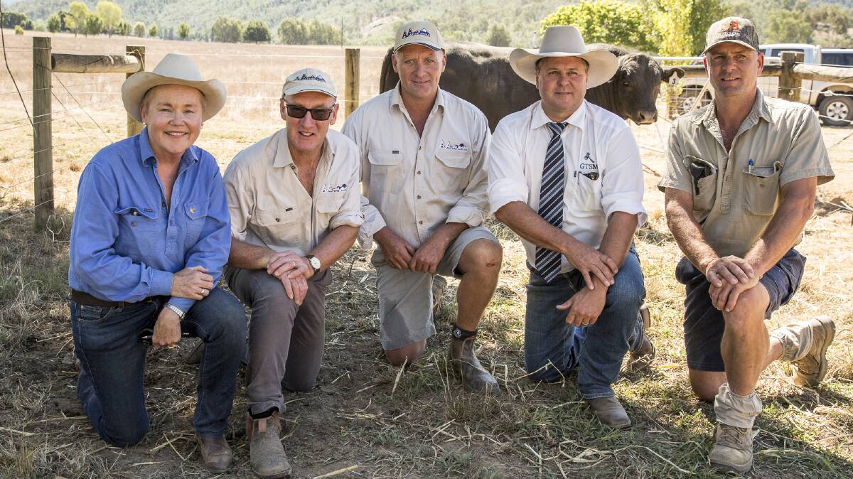 Alpine Angus representatives Suzy Martin, Jim Delany and Chris Oswin, auctioneer Michael Glasser and South Australian client Jock Hislop, JB Angus, bought one of the two sale-topping bulls in the 2017 autumn sale.