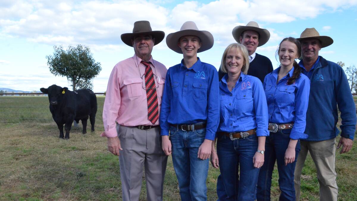 Agent Brian Kennedy, Elders, Hayden, Margaret, Amy and Tim Vincent, Booragul Angus, and auctioneer Paul Dooley, with the $60,000 bull, Booragul Leroy L70.
