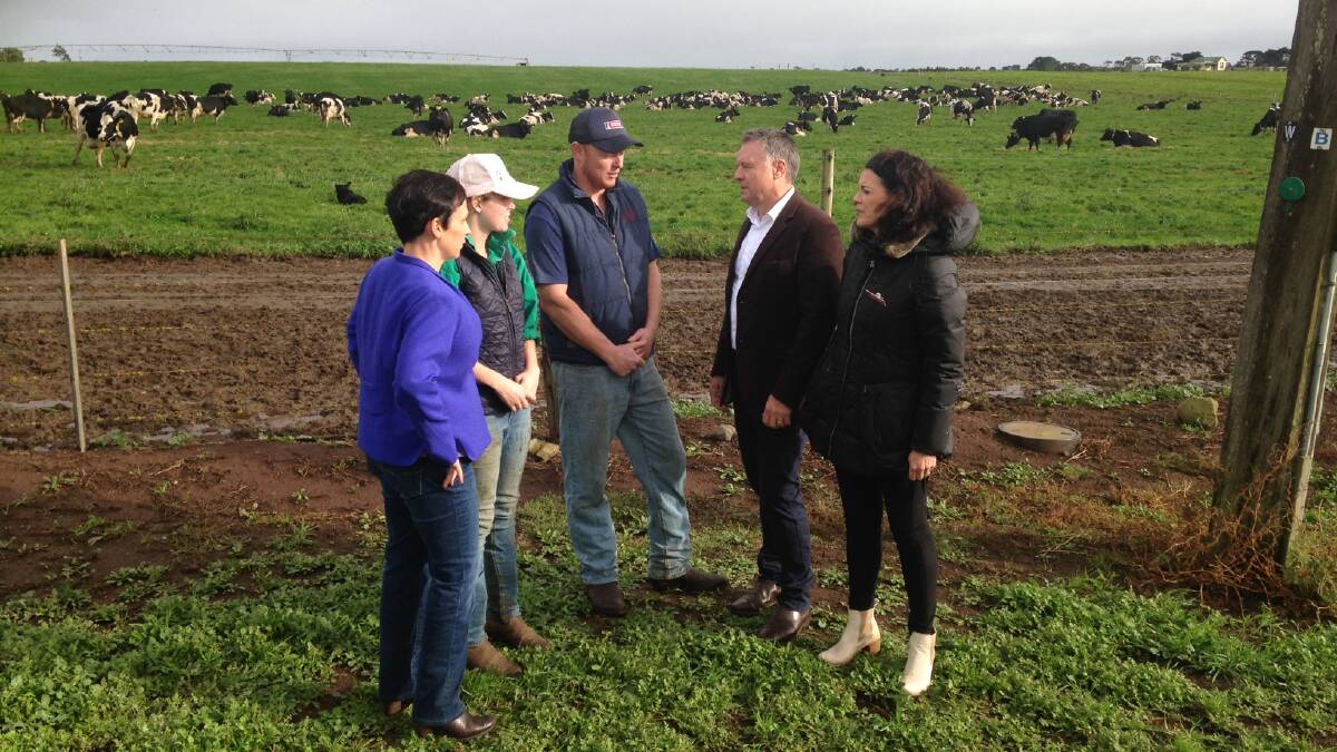 Victorian Agriculture Minister Jaala Pulford (left) with dairy farmers Brooke Lane and Clint Theodore, and Shadow Agriculture Minister Joel Fitzgibbon and Corangamite ALP candidate Libby Coker, meeting in Victoria today near Colac.