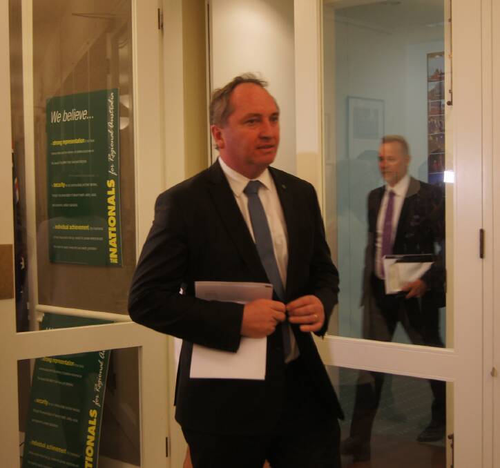 Barnaby Joyce hobbling into the Nationals' party-room meeting in Canberra yesterday.