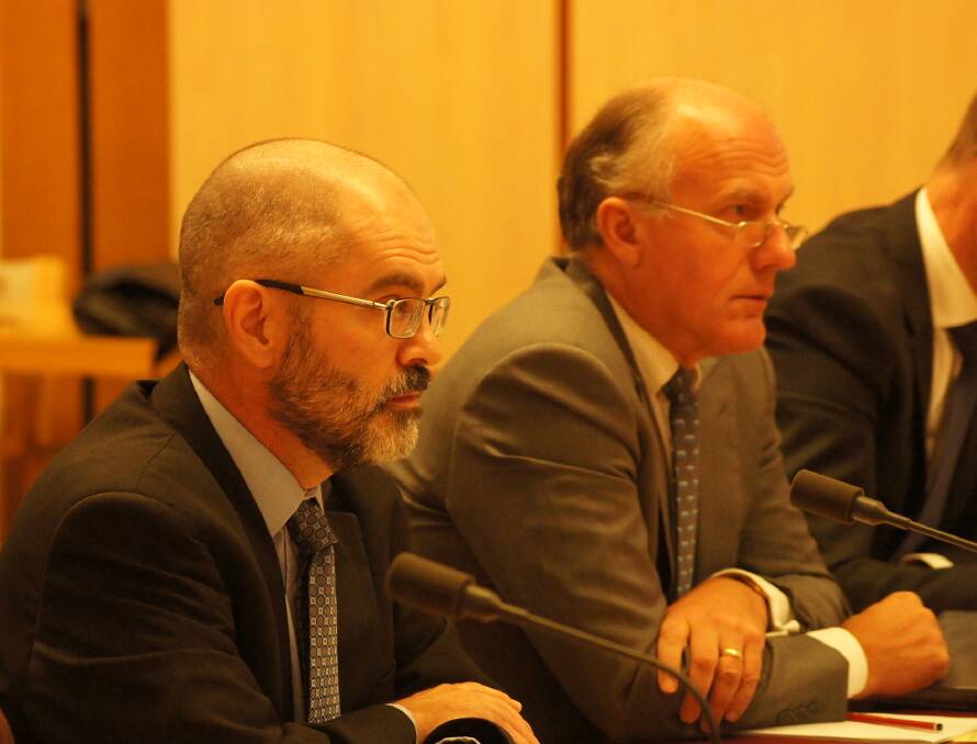 Former Agriculture Department Secretary Dr Paul Grimes (left) at the specially convened senate estimates hearing in March last year shortly before his sacking, alongside former Liberal Minister Eric Abetz.