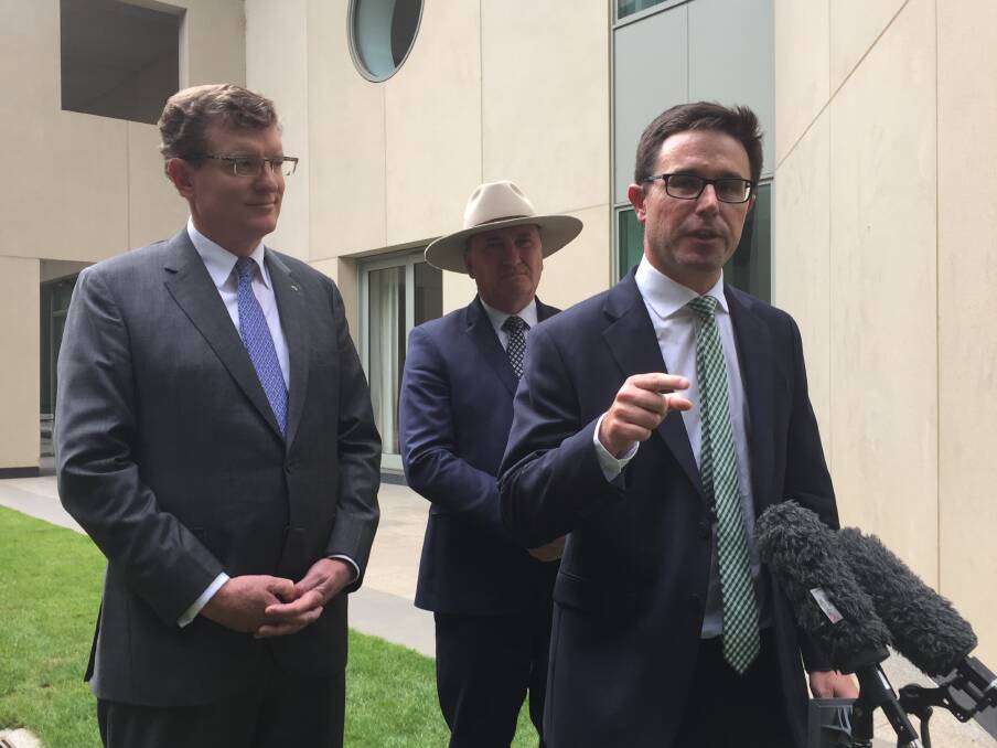 NSW Nationals MP Andrew Gee (left), New England Nationals MP Barnaby Joyce and Agriculture Minister David Littleproud (right) speaking to media in Canberra after securing the 'Barnaby Bank' last month.