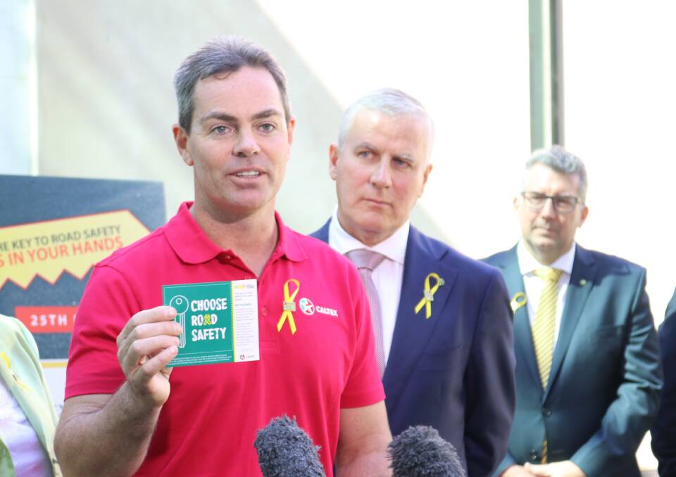 V8 Supercar champion Craig Lowndes (left), Transport Minister Michael McCormack and Assistant Minister to the Deputy Prime Minister Keith Pitt.