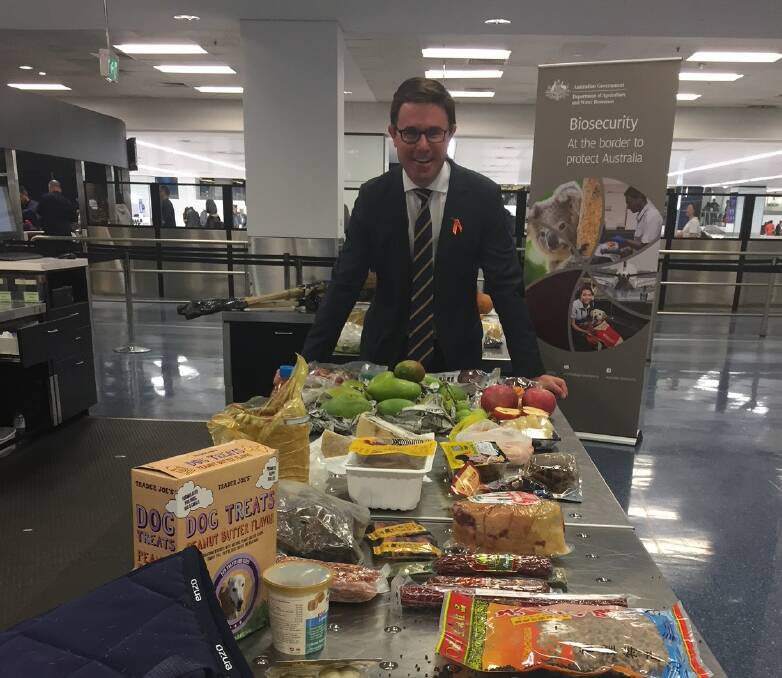 Federal Agriculture and Water Resources Minister David Littleproud at Sydney airport today with some of the risky items intercepted by biosecurity officials at the border. (picture supplied).