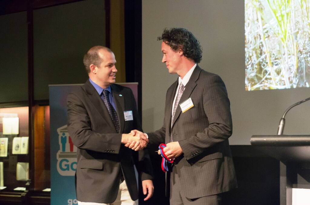 NATIONAL WINNER: University of Southern Queensland's Dr Keith Pembleton accepts the GovHack Paddock to Plate award from Professor Andrew Lowe, University of Adelaide for the John Conner vegetable heat stress warning system. 